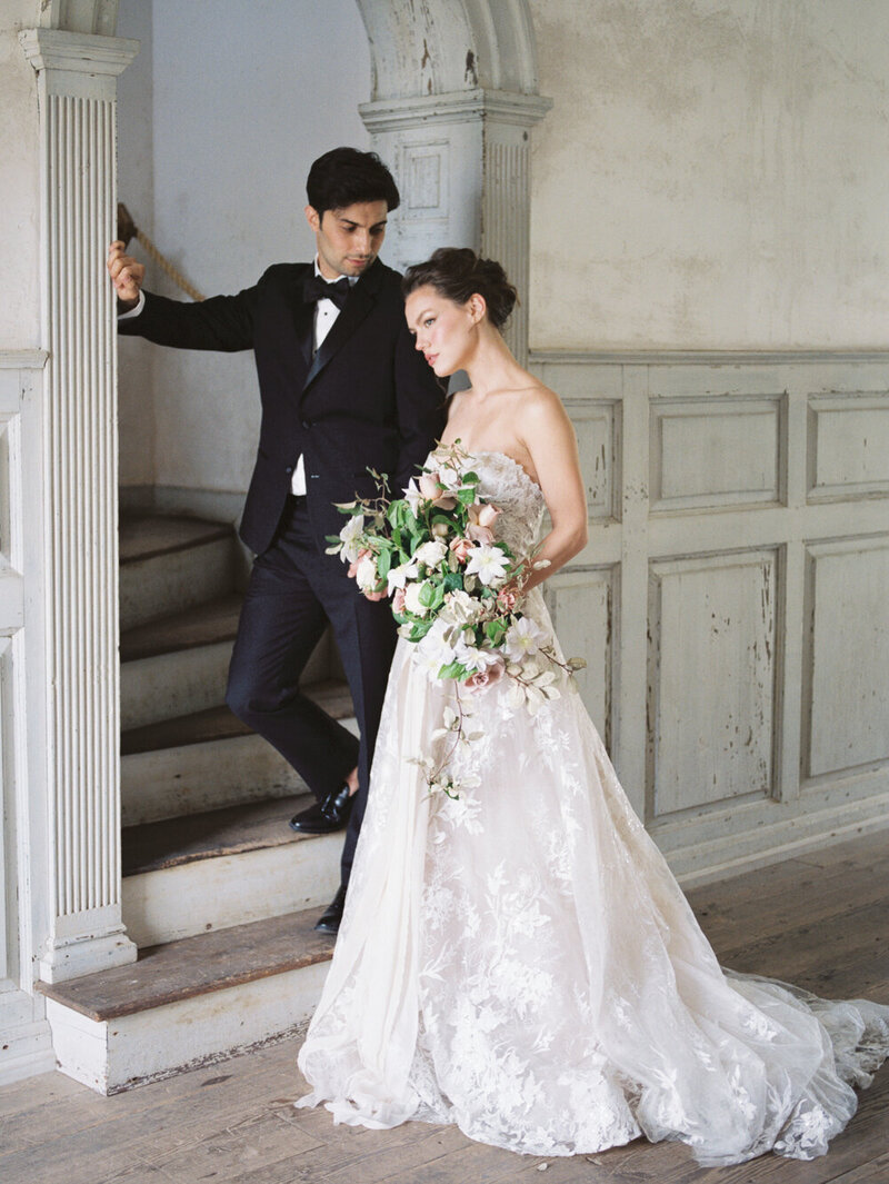 Bride in Monique Lhuillier gown with groom at high end wedding at Salubria