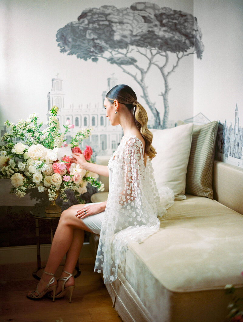 The Bride discovering her brunch of flowers in her Tour Eiffel Suite in Paris