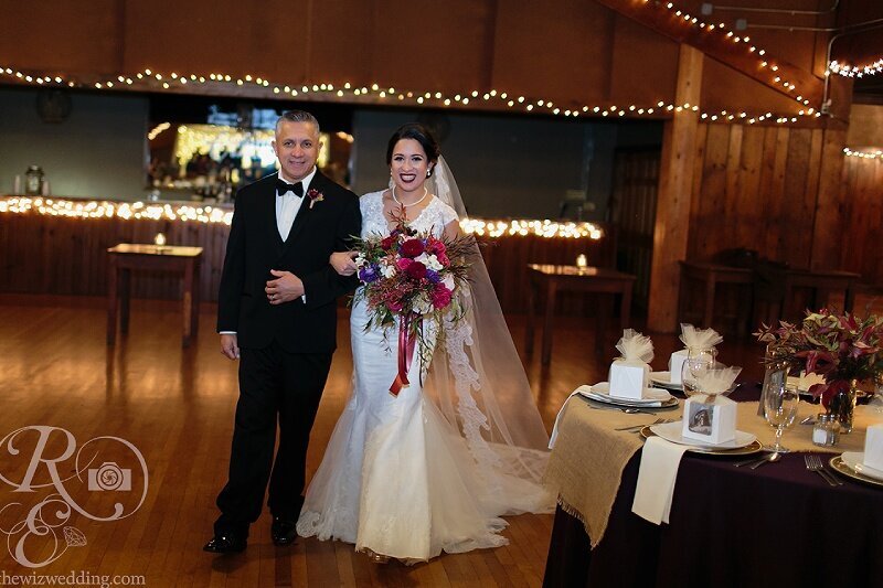 An elegant bride poses on the grand staircase of the historic Ohio Theatre at Playhouse Square in Cleveland, Ohio. The stunning architecture and classic decor highlight the beauty of this timeless wedding moment.