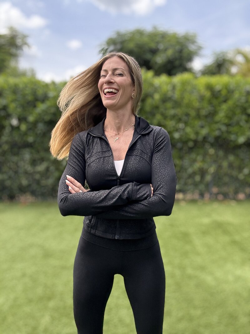 Jill smiling in a jogging suit