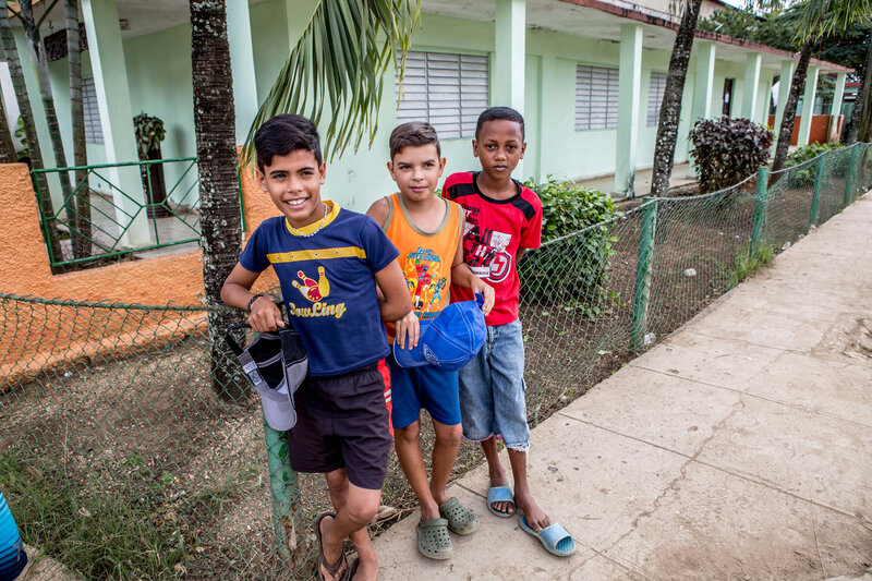3 young boys smiling Cuba