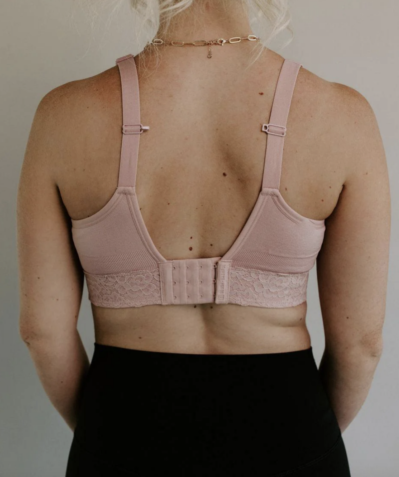 Back of a woman's pink bra