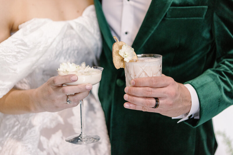 Las vegas wedding photographer captured photos of a couple together holding signature cocktails