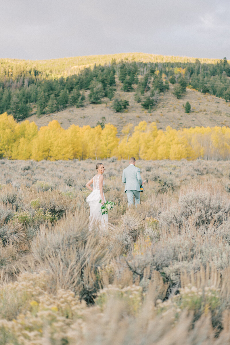Kelsi and Everet share a sweet moment at their autumn Aspen wedding.