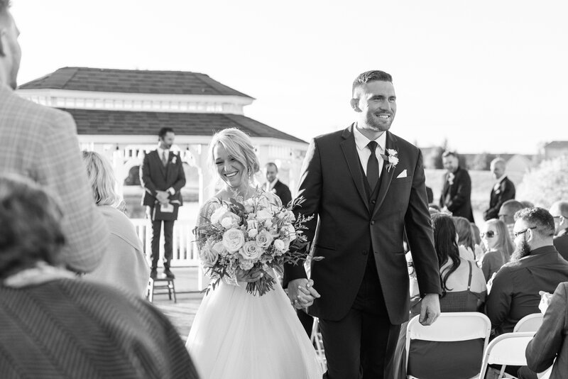 bride and groom ceremony recessional by The Charles Fort Wayne Wedding Photographer Courtney Rudicel