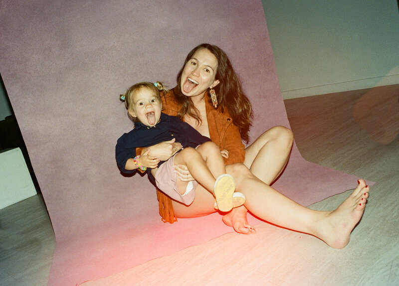 Couple sitting on couch with dog at Austin family photoshoot