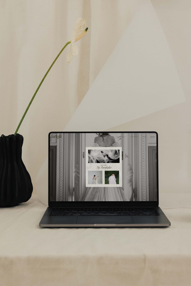 legant Showit website template for wedding photographers — laptop screen showcasing Isabella design for fine art brands ready to charge premium prices.