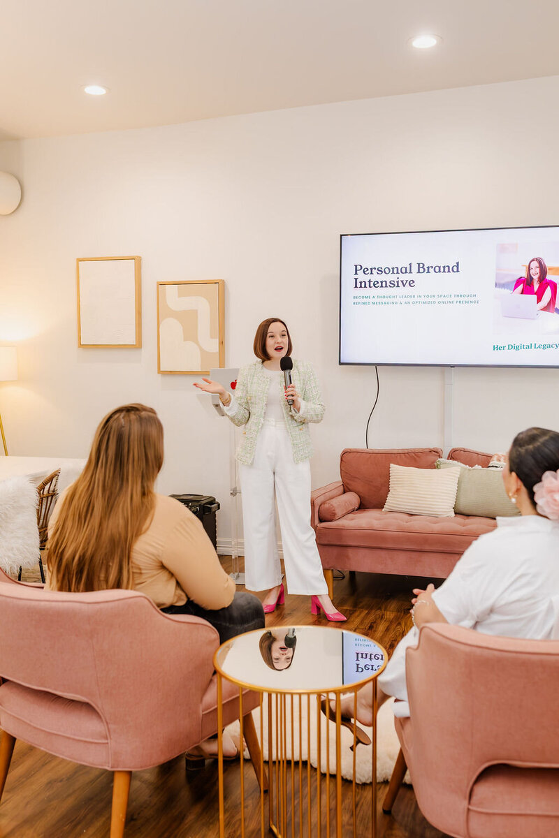 Young woman explaining the concept of a personal brand on a whiteboard