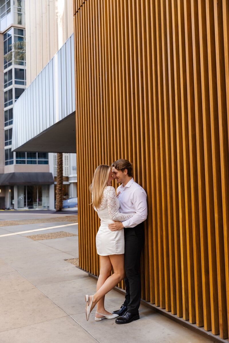 couple embraces for engagement photos in arizona