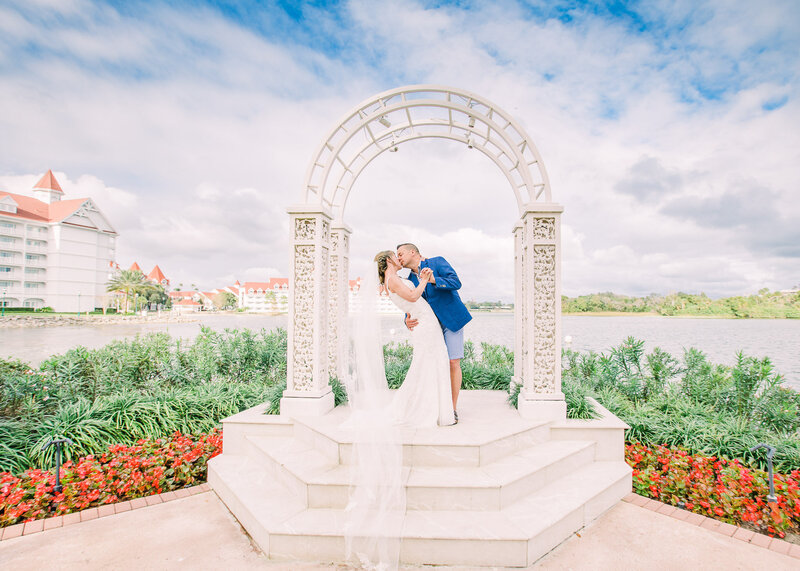 Disney Wedding with bride and groom kissing at Disney's wedding pavilion
