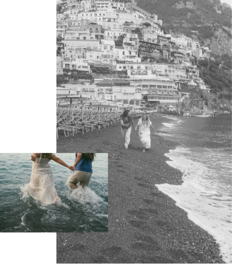Two women running on the beach in Positano Italy