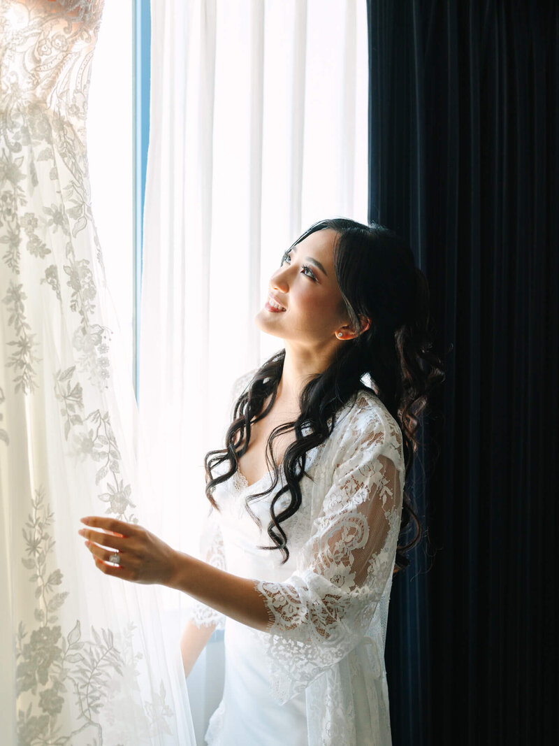 bride admiring her dress