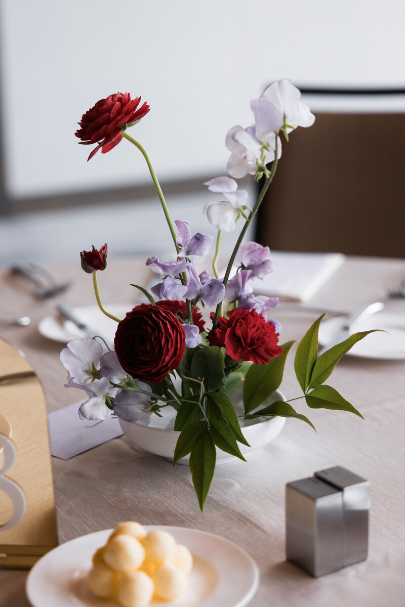 Centerpieces at of red and lavender wedding centerpiece.