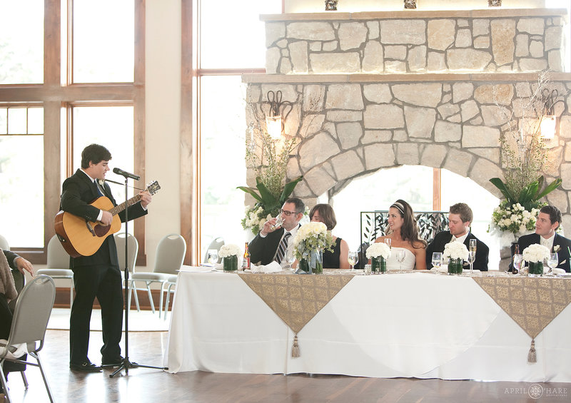 Head table set up in front of double sided stone fireplace at Cielo at Castle Pines in Colorado