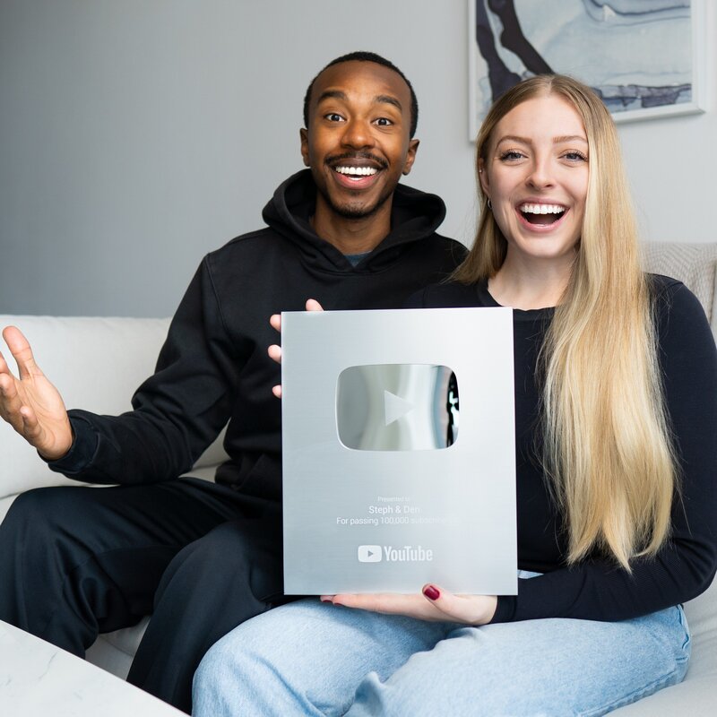 Steph and Den holding their Youtube plaque
