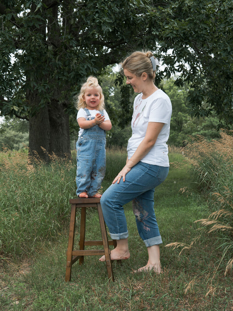 Bride and groom sharing a joyful, intimate kiss under the veil during their wedding ceremony