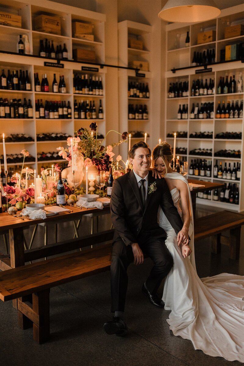 Intimate spring wedding ceremony with floral installation and candleligh