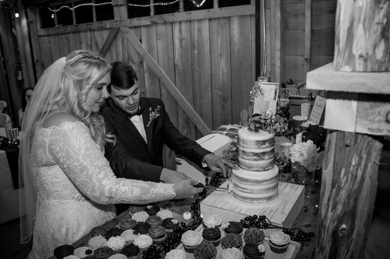 Bride and Groom cutting cake | Taken By Maine Wedding Photographer