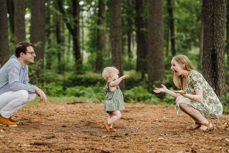 one year old walks to mom during first birthday photoshoot