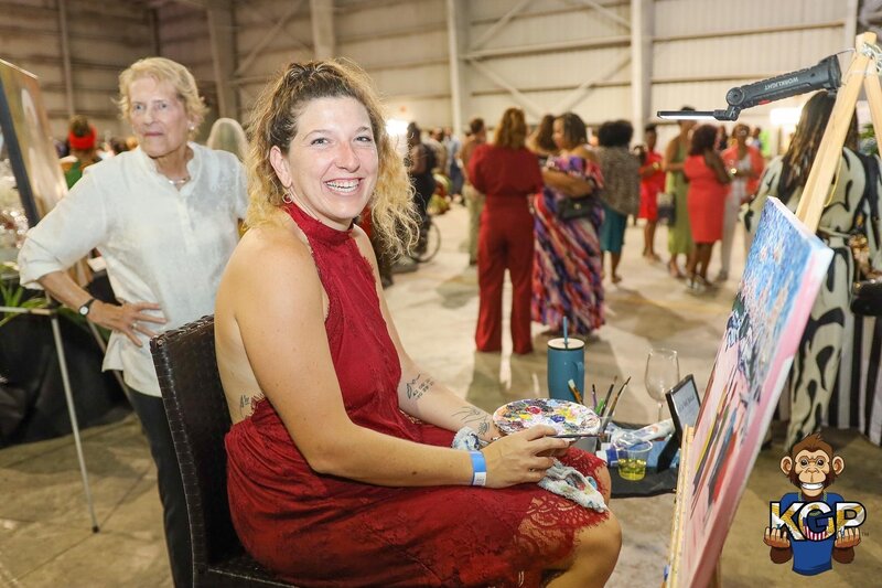 Brin at a live event painting a portrait