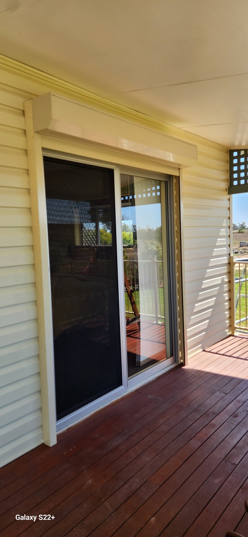 Stylish outdoor area with hinged glass doors, offering a seamless connection between indoor and outdoor spaces.