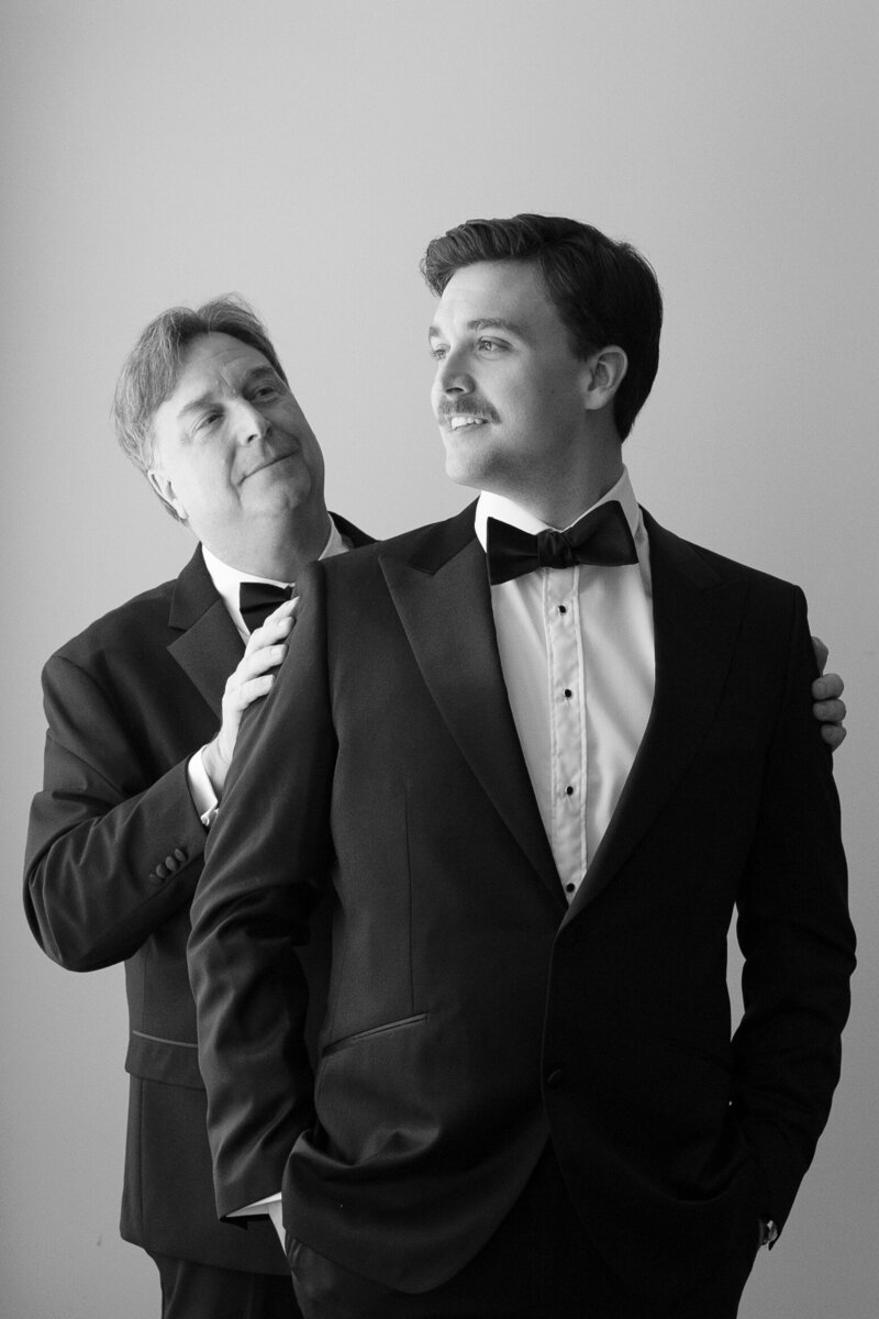 groom getting ready with dad  by wedding photo tampa