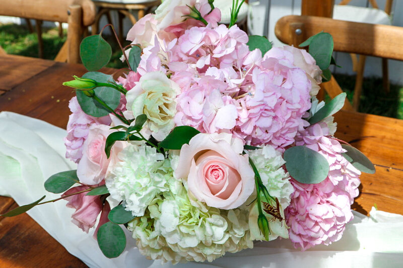 Close-up of pastel floral arrangement with roses and hydrangeas