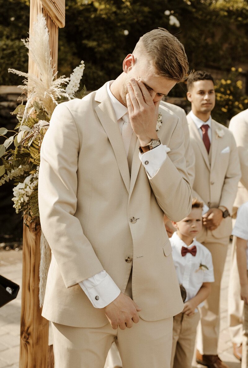 groom crying seeing his bride for the first time at their lake tahoe wedding