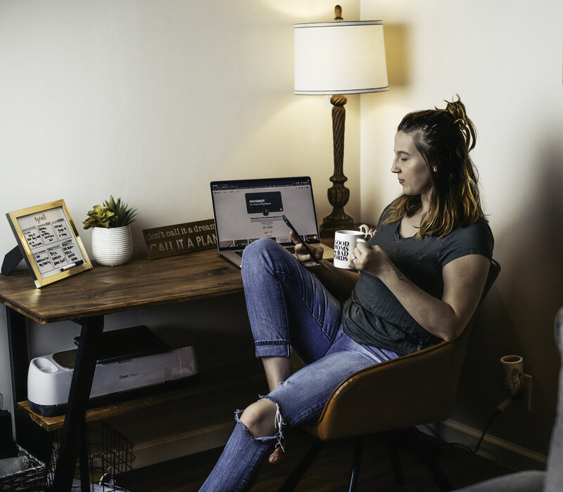 The Comma Mama Co doing content research and planning at her desk