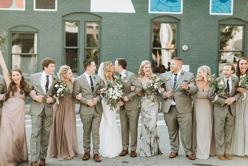 Wedding party crossing the street in Atlanta  with locked arms