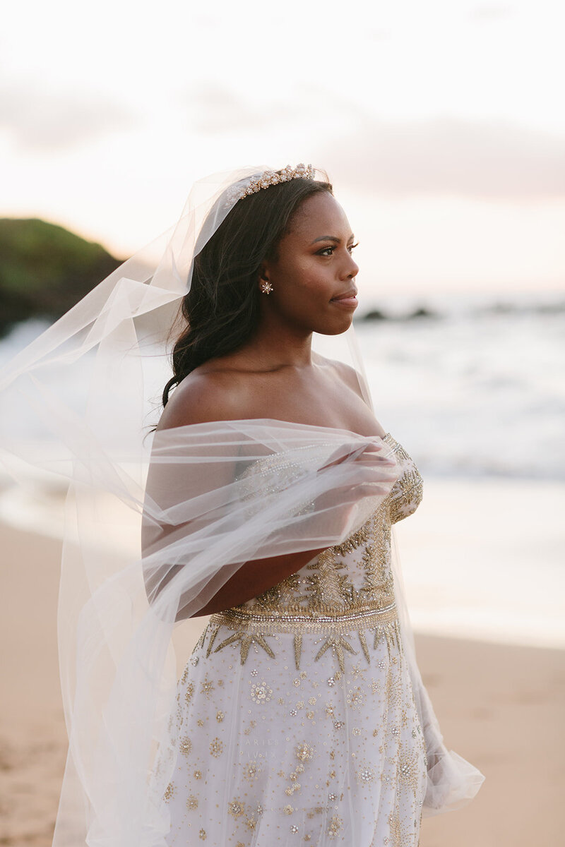 bride in front of ocean on wedding day