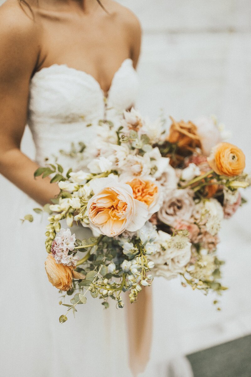 Photo of a boquet of flowers on a desk.