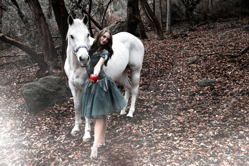 Dancer in forest with white horse