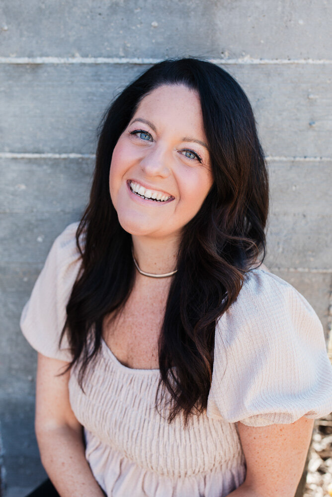 anxiety healer Allison Seponara in front of grey backdrop