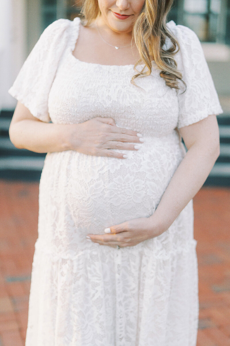 close up photo of mom holding belly
