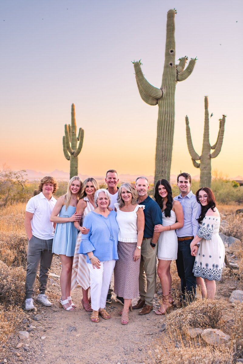 Extended Family posing for family photos  in Silverleaf Neighborhood in Scottsdale Az