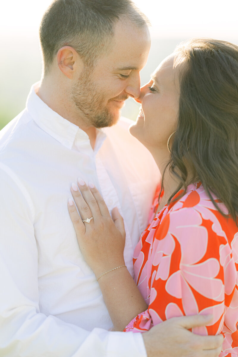 Couple kissing at outdoor engagement photo session in Peachtree City GA