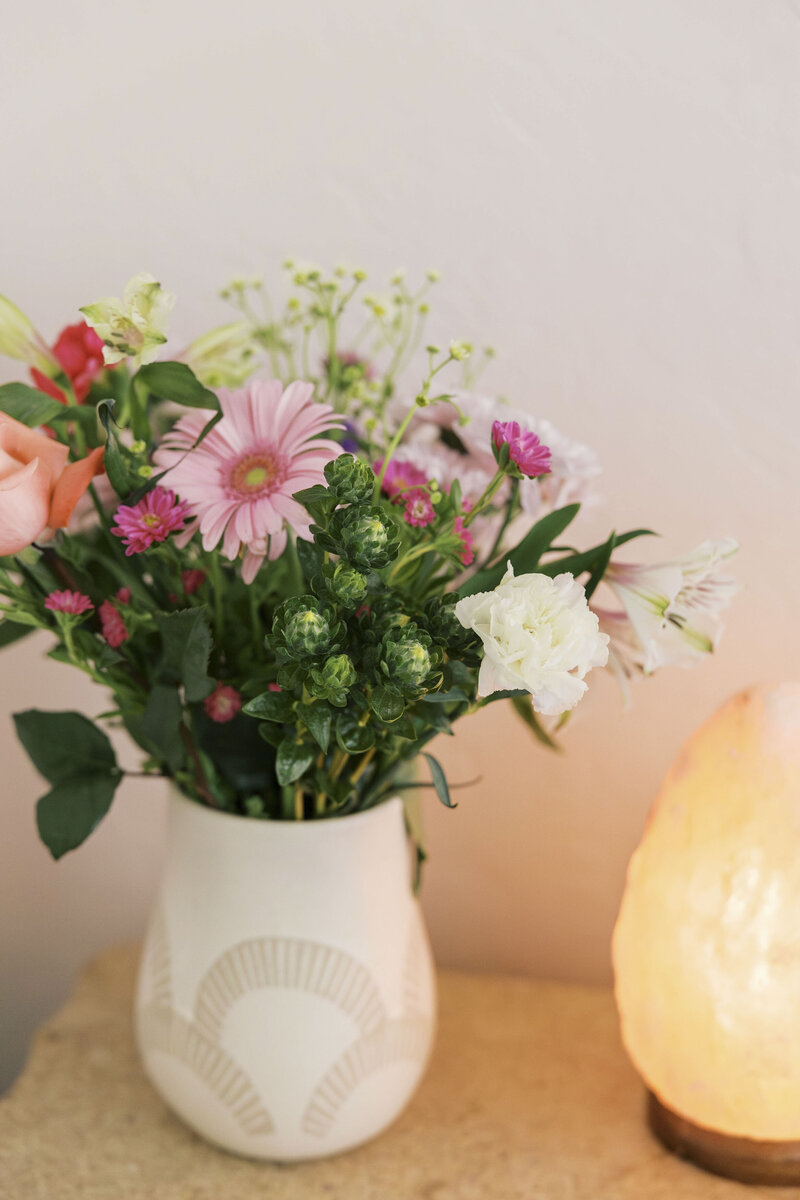 Corner of therapy office with flowers and salt lamp in Tucson AZ