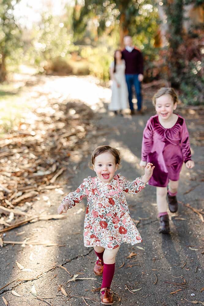 colorful family photographer in livermore, CA - little girls running