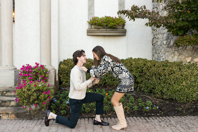 Proposal photos of man kneeling down and woman crying happy tears
