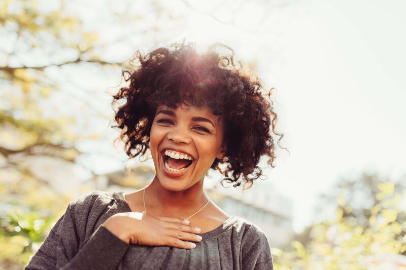 Happy woman rediscovering joy through therapy