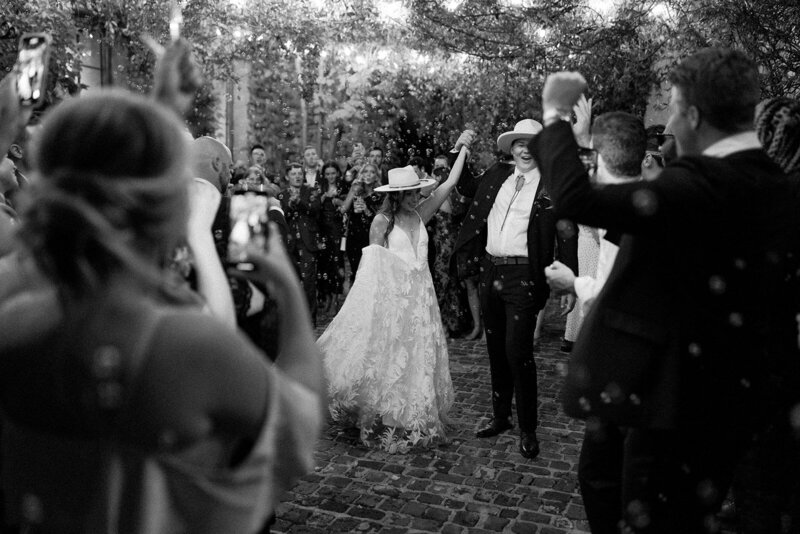 Bride and groom at their western wedding in atlanta georgia during a bubble exit