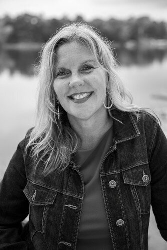 Jen Todd in a jean jacket black and white