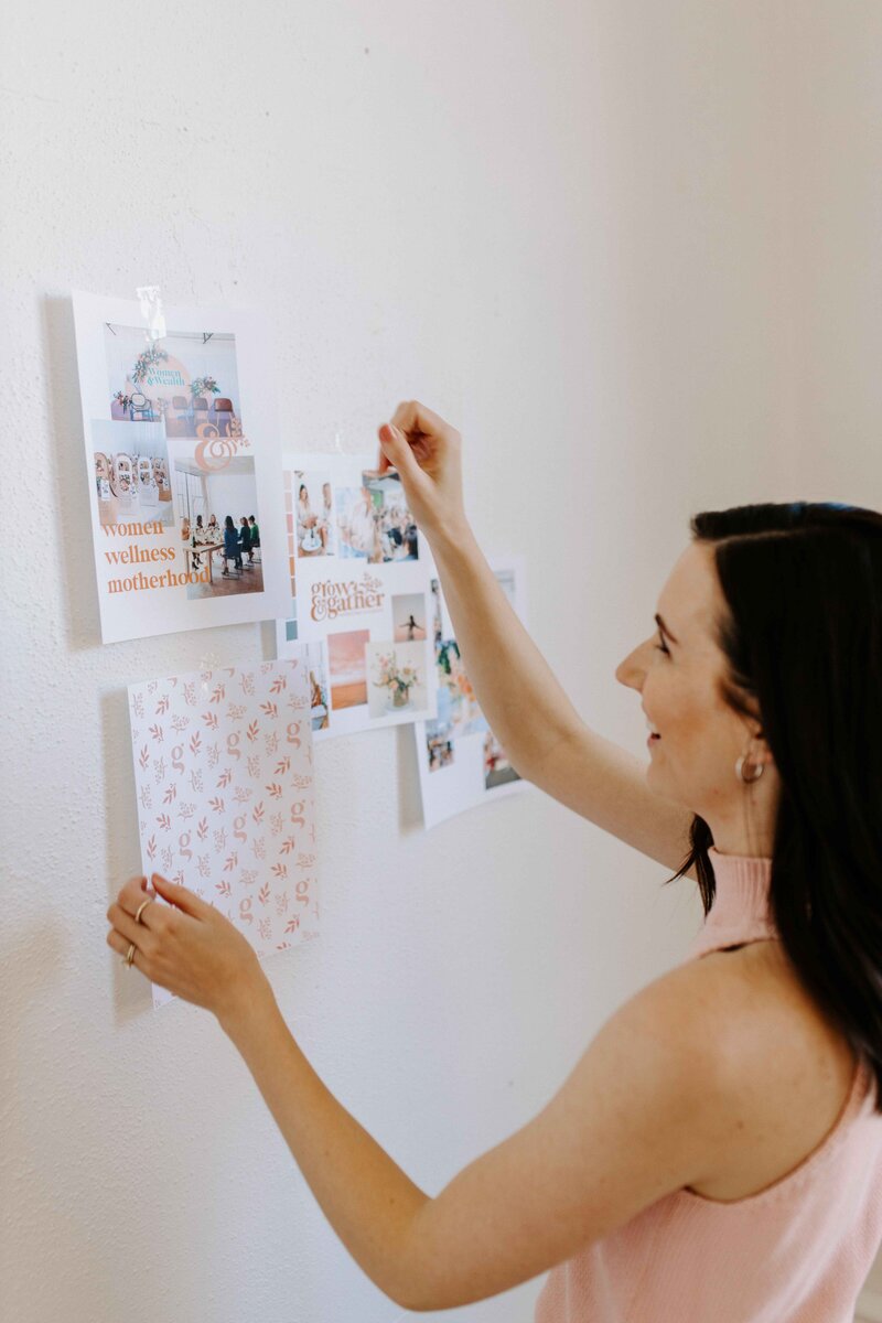 Woman with dark hair looking at brand elements