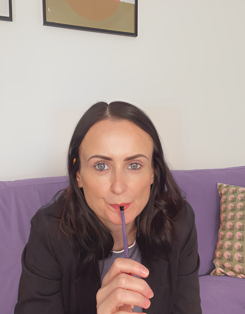Teresa Quinn planning brand and marketing strategies. Her expertise helps small businesses stand out and connect with ideal clients.