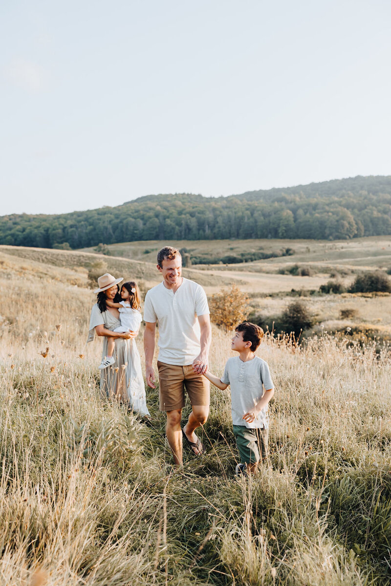 Multi-cultural family in field