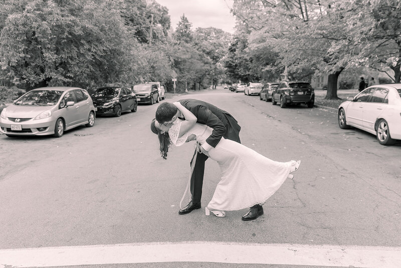 Bride and groom on the stairs at the park