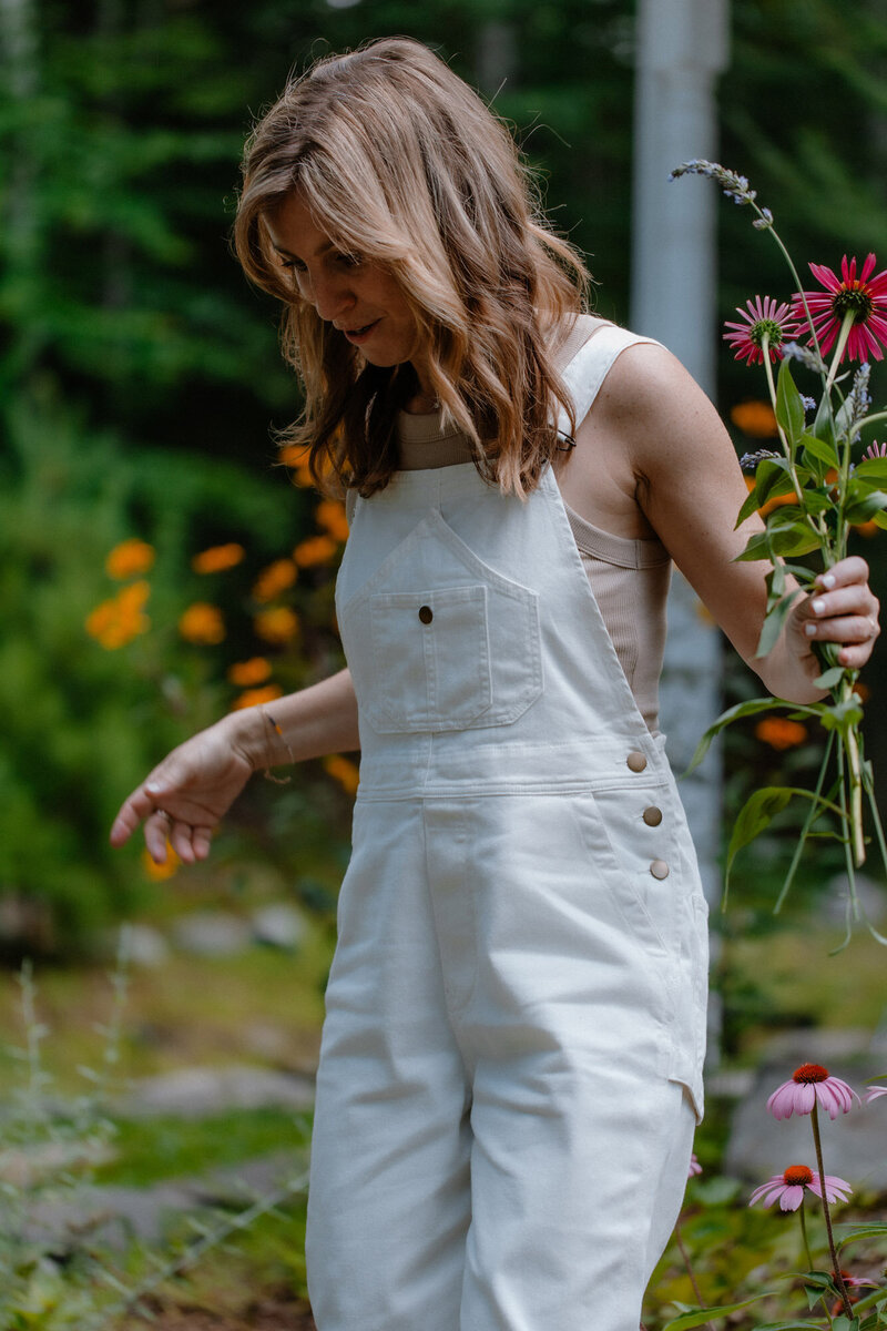 Sam picking wildflowers in her garden