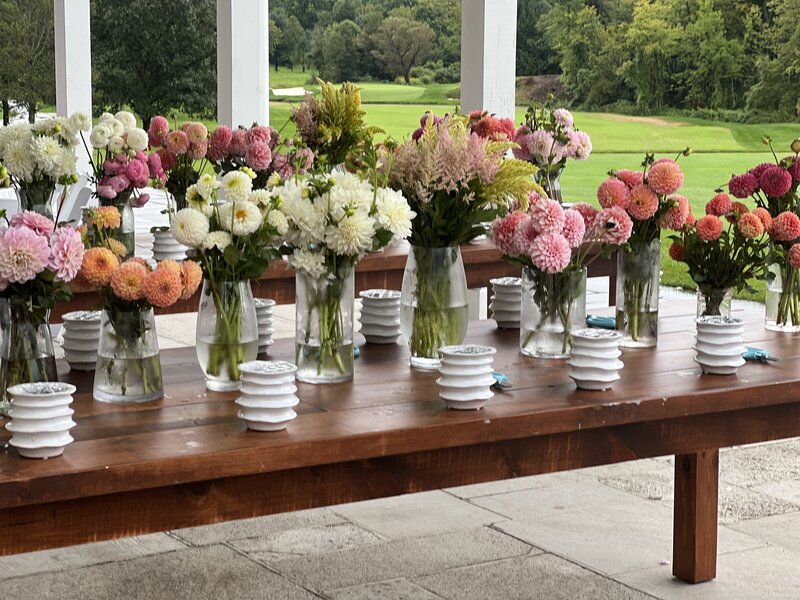 Photo of a boquet of flowers on a desk.