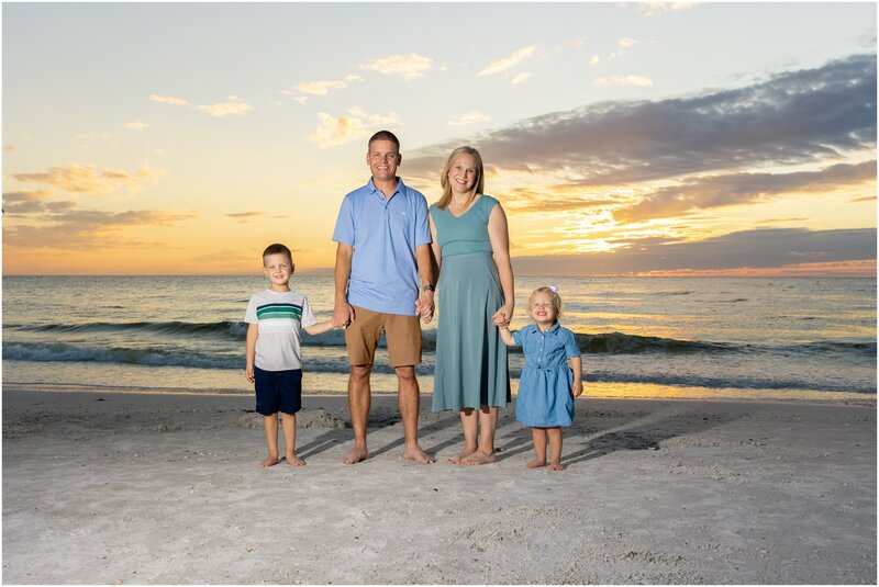 A family photo on the beach at Anna Maria Island  captured by Love and Style Photography